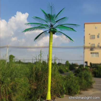 Outdoor lighted palm tree with coconuts