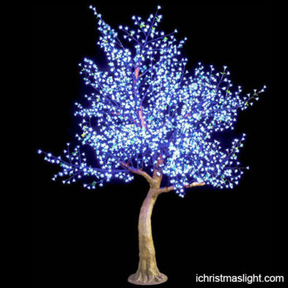Blue pre lit Christmas tree for yard decor