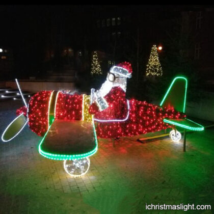 Outdoor LED lighted Santa on airplane